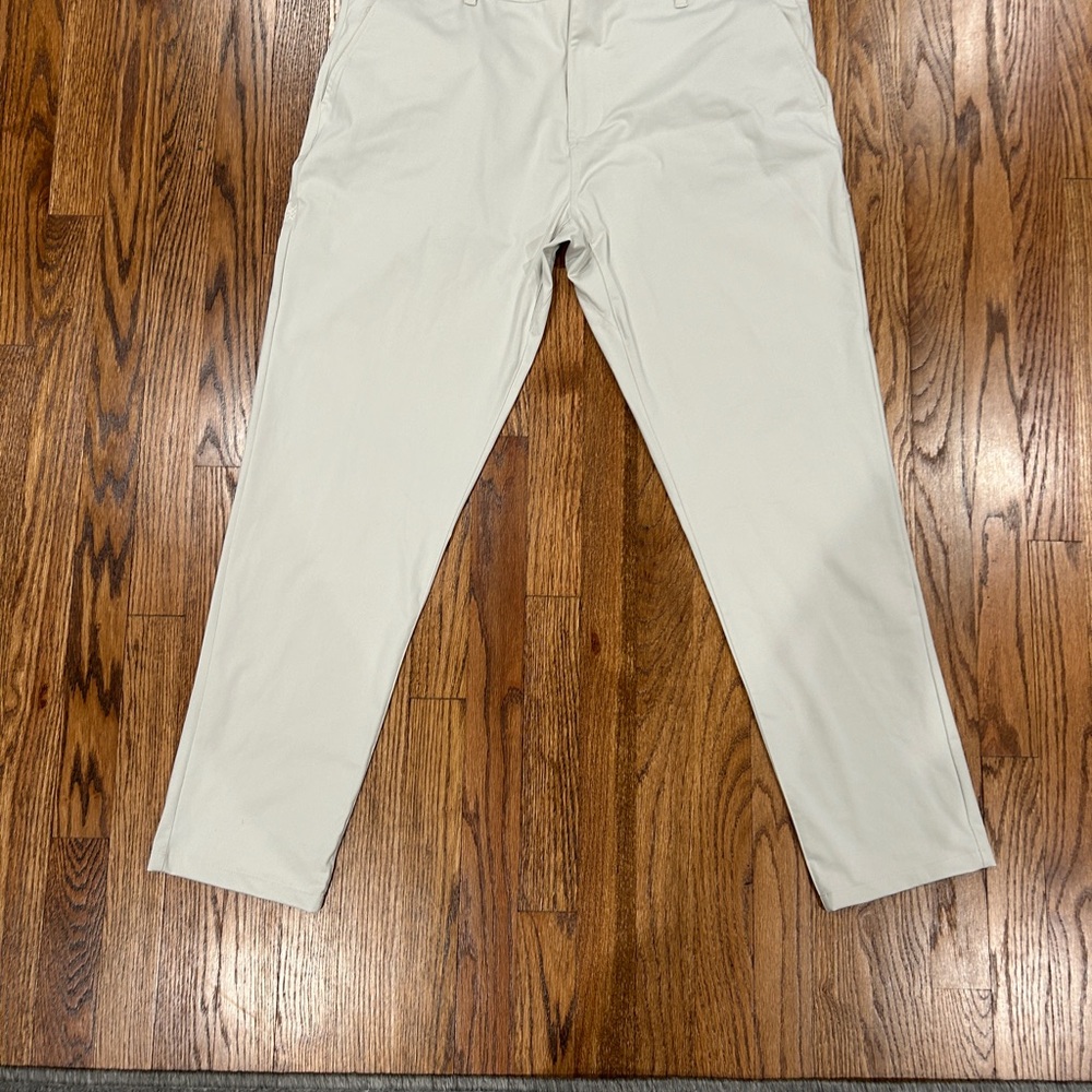 Rhône men’s  slim commuter tan Pants. Size 38 - barely worn!